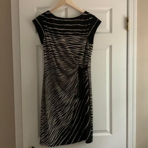 Black and tan dress with capped sleeves.